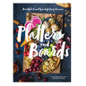 The front cover of the book 'Platters and Boards' by Kelly Westerbaechen and Steve Winkels, featuring a colorful, rustic food platter on a dark textured background.