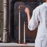https://cdn.shopify.com/s/files/1/0562/0914/6006/products/Parchmentwhitedippedtapercandles_coppertapersnuffer.jpg?v=1769981075