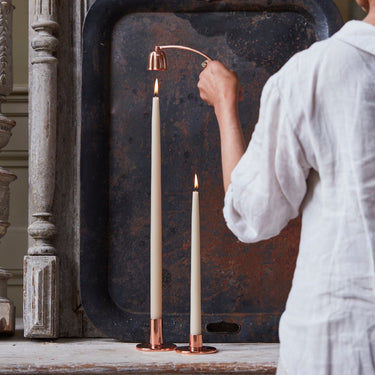 https://cdn.shopify.com/s/files/1/0562/0914/6006/products/Parchmentwhitedippedtapercandles_coppertapersnuffer.jpg?v=1769981075