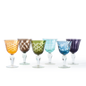Set of six colorful glass goblets on a white background
